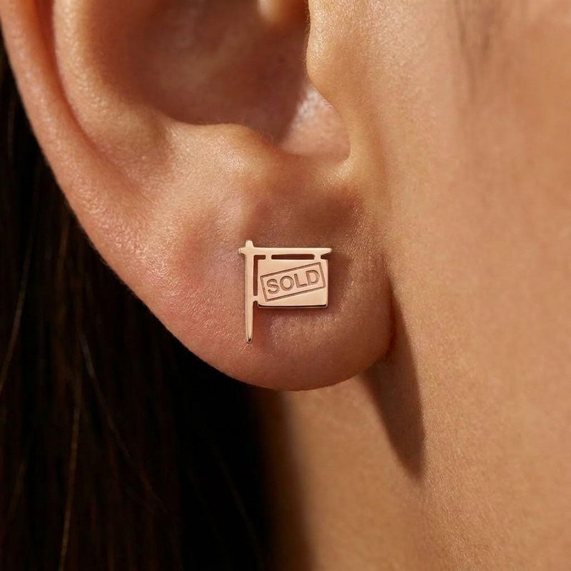 Pair of small gold yard sign stud earrings with the word SOLD cut into the face (4 of 7)