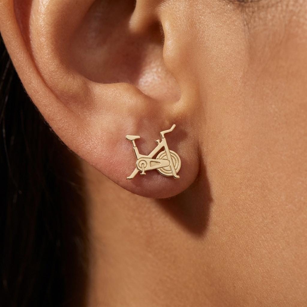 Pair of gold stud earrings shaped like a stationary exercise bike (2 of 7)