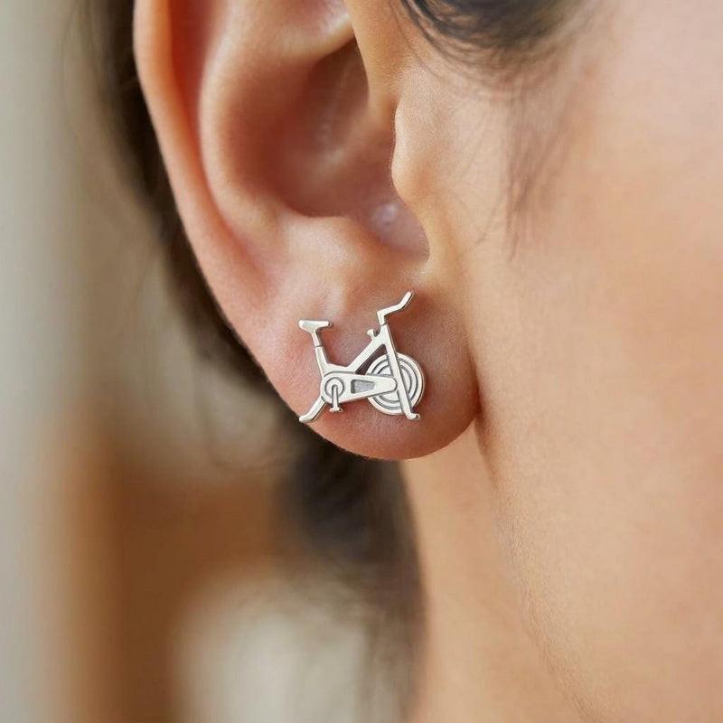 Pair of gold stud earrings shaped like a stationary exercise bike (3 of 7)