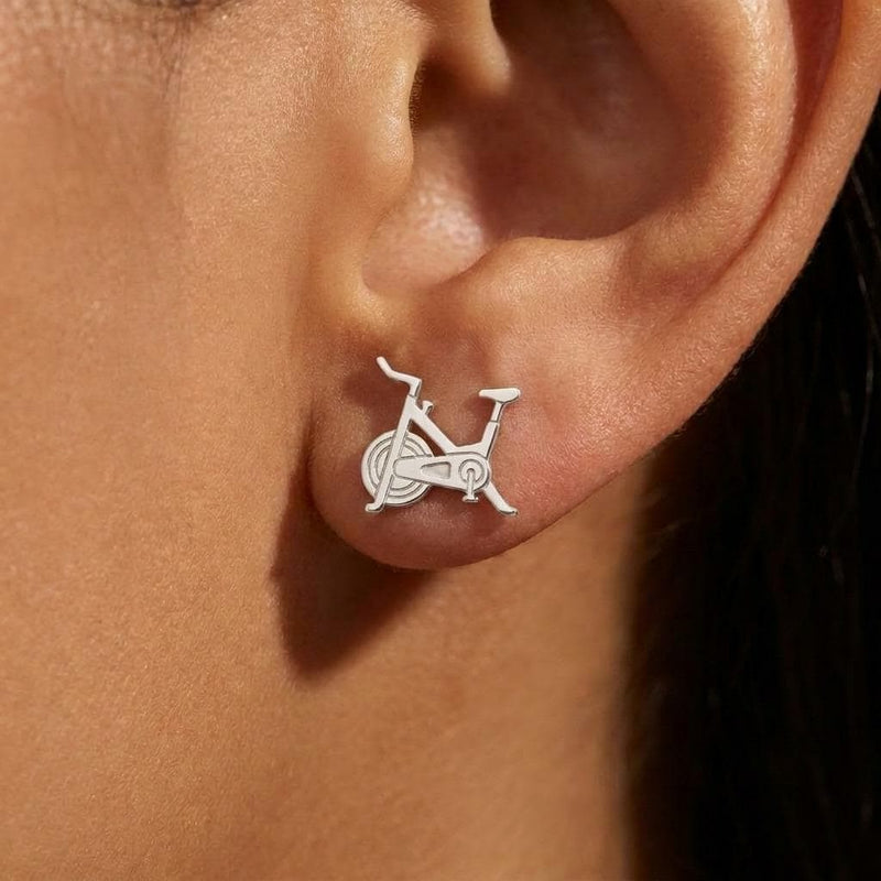 Pair of gold stud earrings shaped like a stationary exercise bike (4 of 7)
