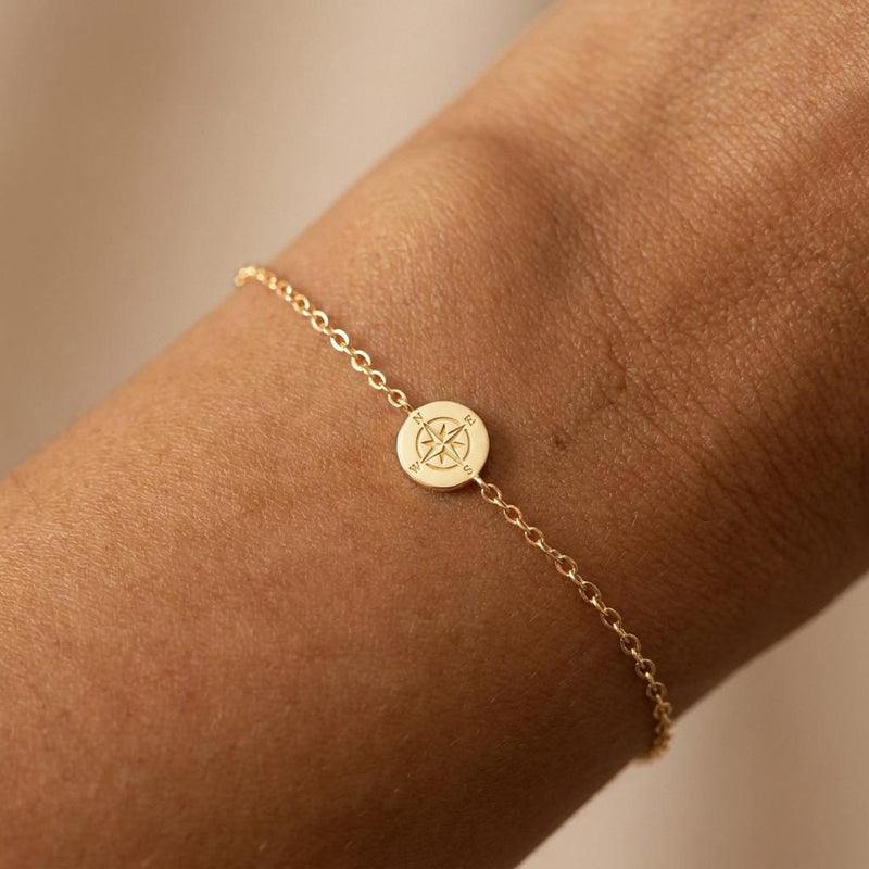 Fine chain bracelet with a tiny round gold compass charm (2 of 7)