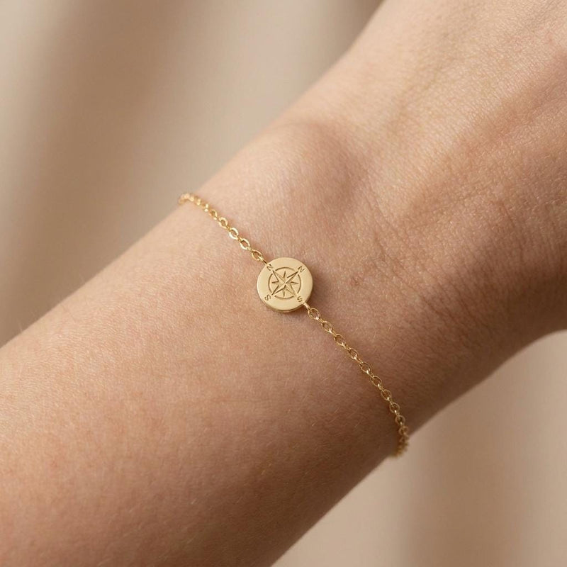 Fine chain bracelet with a tiny round gold compass charm (3 of 7)