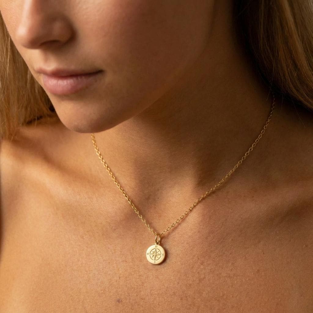 Tiny gold compass pendant with needle detail on a fine cable chain (2 of 7)