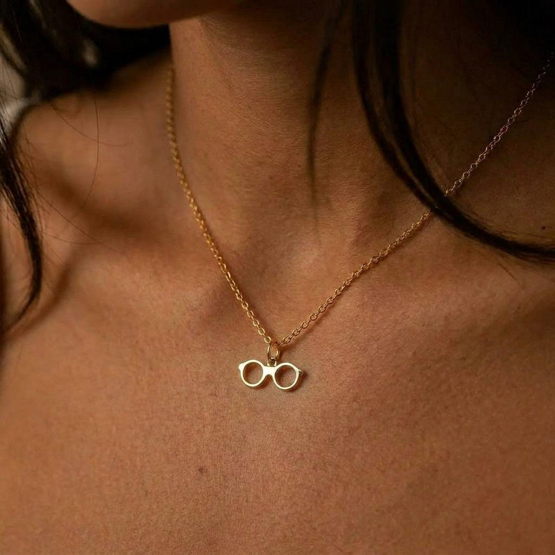 Fine gold chain necklace with a small round eyeglasses pendant (3 of 9)