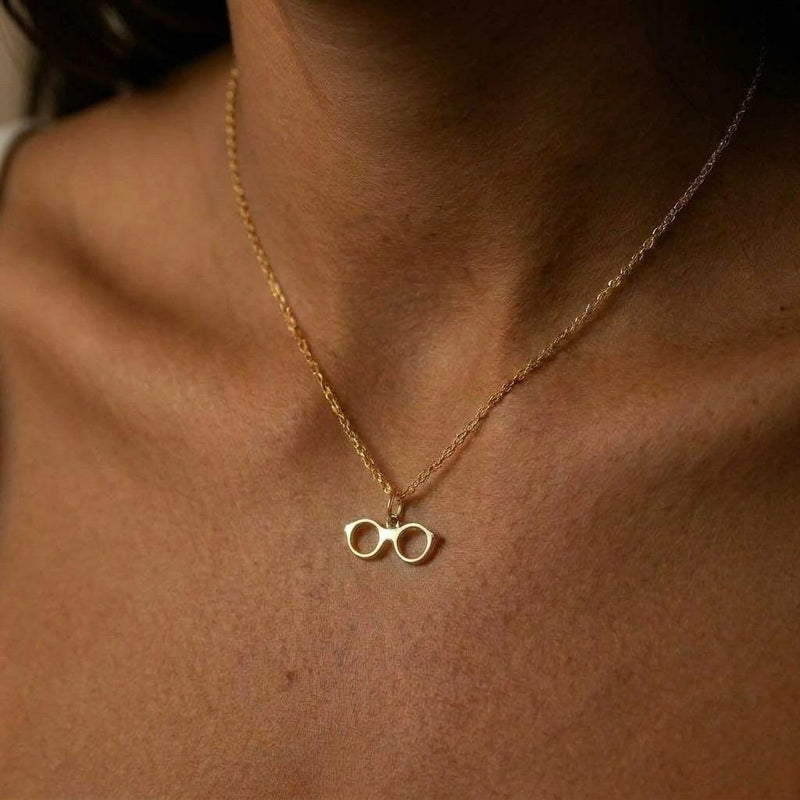 Fine gold chain necklace with a small round eyeglasses pendant (5 of 9)