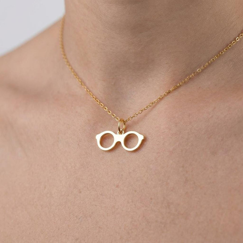 Fine gold chain necklace with a small round eyeglasses pendant (9 of 9)