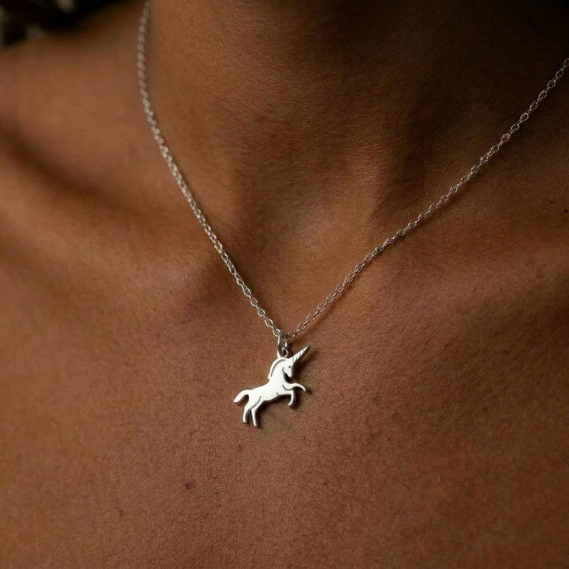 Tiny gold unicorn pendant with a single horn on a fine cable chain (4 of 7)