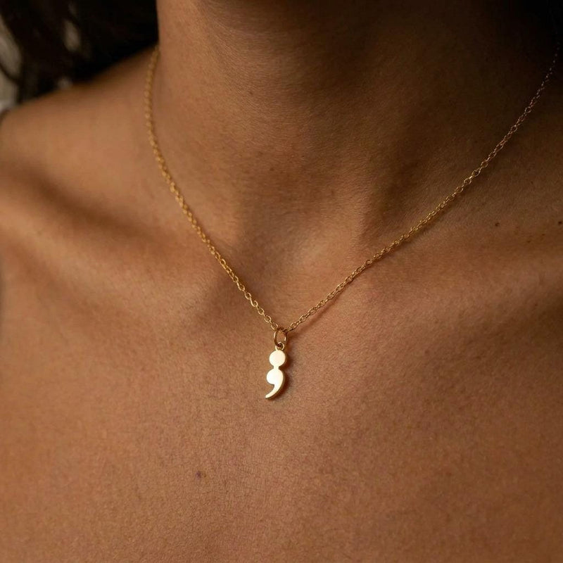 Fine gold chain necklace with a small semicolon shaped pendant (3 of 7)