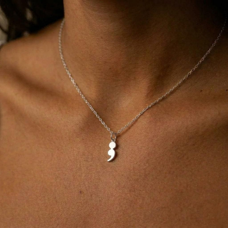 Fine gold chain necklace with a small semicolon shaped pendant (4 of 7)