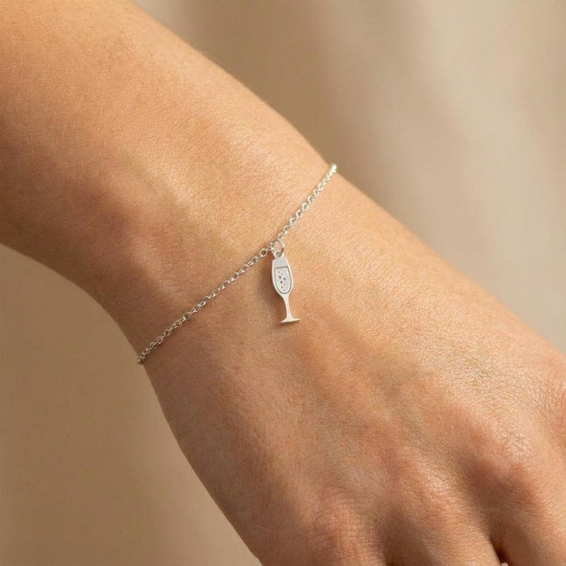 Fine gold chain bracelet with a slim champagne flute charm (2 of 8)