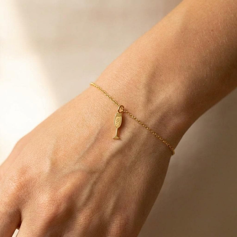 Fine gold chain bracelet with a slim champagne flute charm (3 of 8)