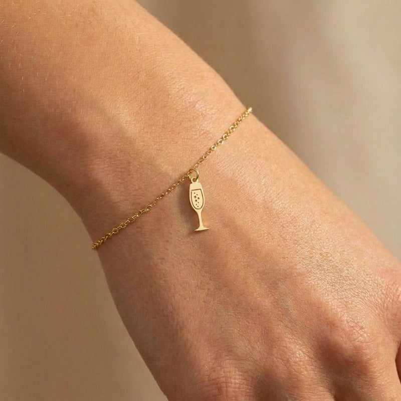 Fine gold chain bracelet with a slim champagne flute charm (4 of 8)