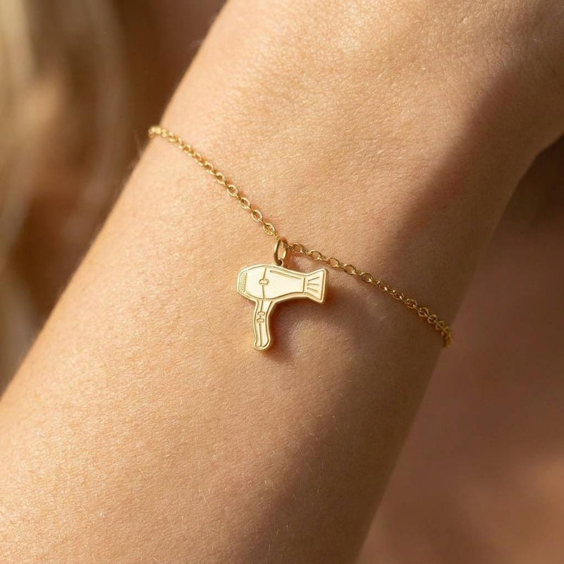Fine gold chain bracelet with a small hair dryer charm with a curled cord (2 of 7)