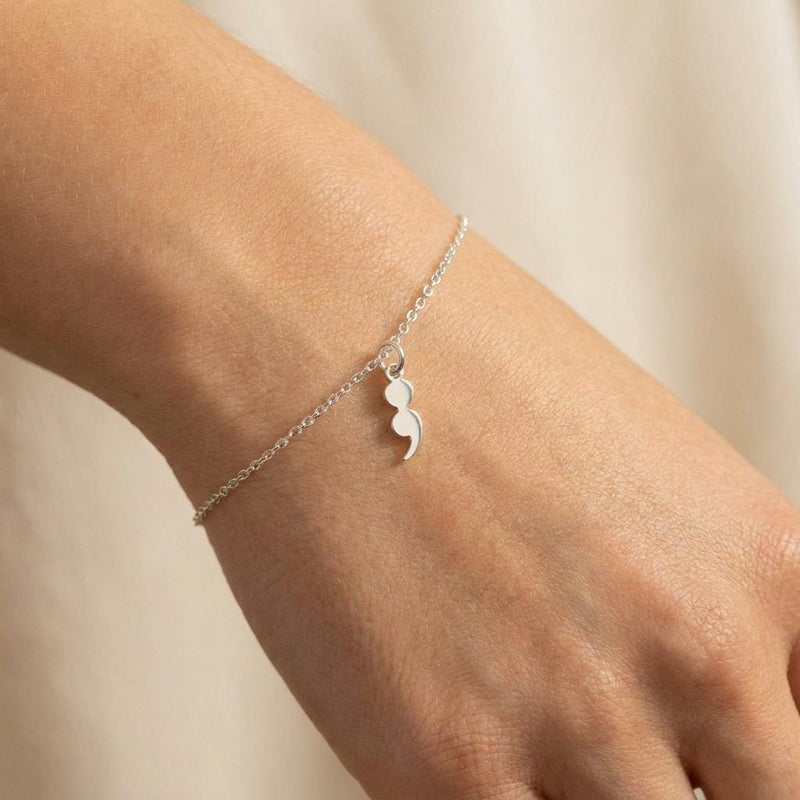 Fine gold chain bracelet with a small semicolon charm (3 of 7)