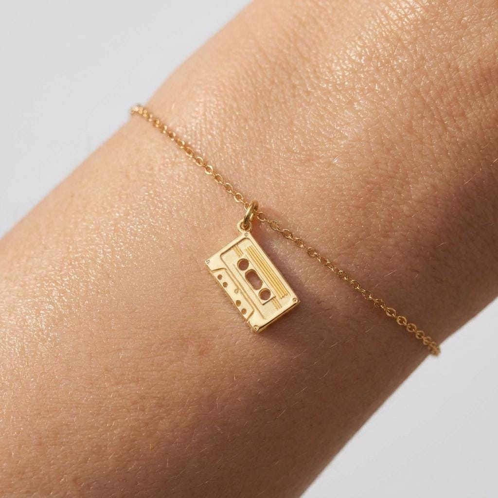 Fine gold bracelet with a flat cassette tape charm (2 of 6)