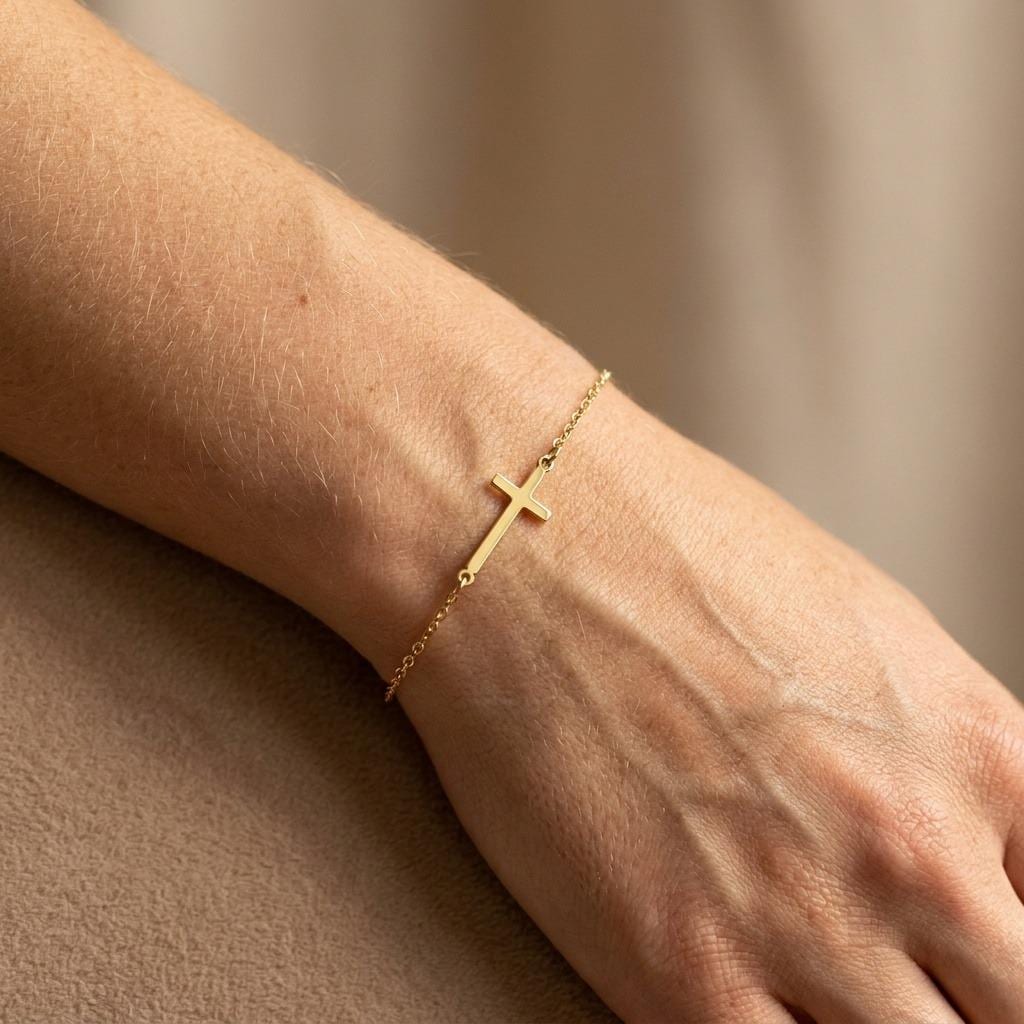 Fine gold bracelet with a small plain cross charm and lobster clasp (2 of 6)