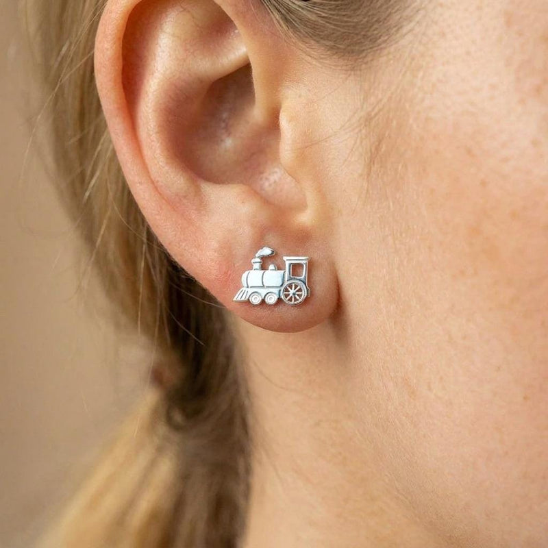 Pair of small steam train engine stud earrings in gold, shown from the side (5 of 8)