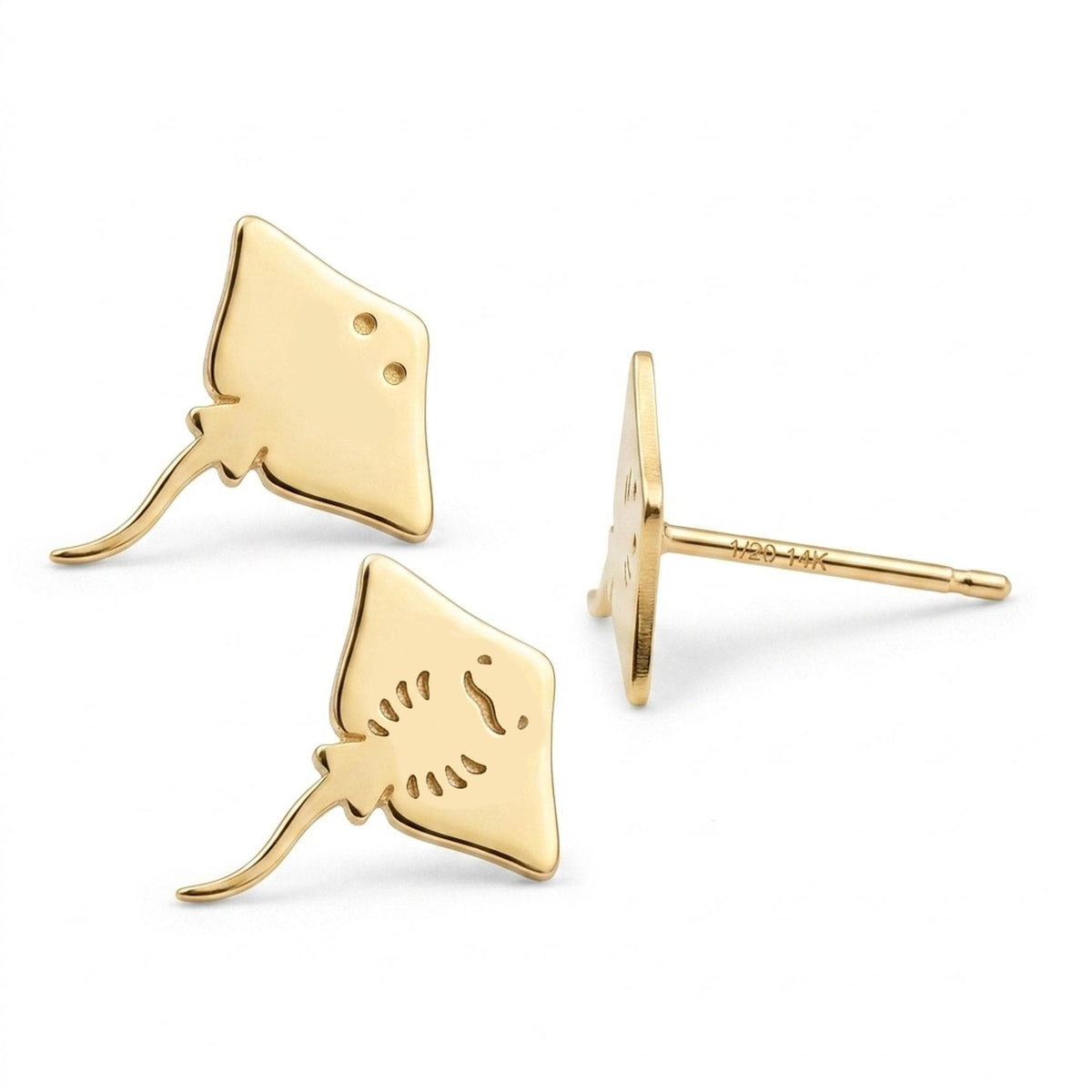 Pair of small gold stingray stud earrings with tapered wings and a fine tail