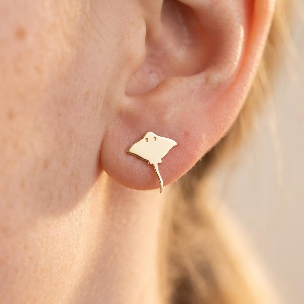 Pair of small gold stingray stud earrings with tapered wings and a fine tail (2 of 7)