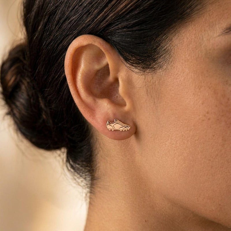 Pair of gold soccer cleat stud earrings shown in profile with lace detail (4 of 8)