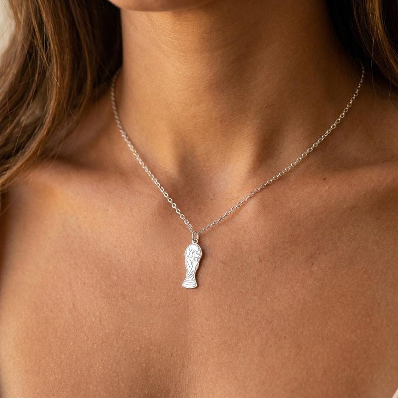 Small gold soccer trophy pendant on a fine cable chain, photographed on white (2 of 6)