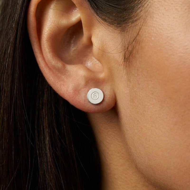 Pair of tiny gold eight ball stud earrings with the number cut into a raised circle (3 of 8)