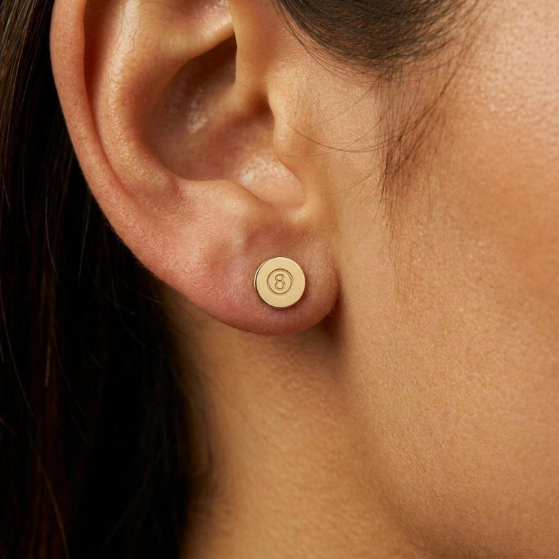 Pair of tiny gold eight ball stud earrings with the number cut into a raised circle (4 of 8)