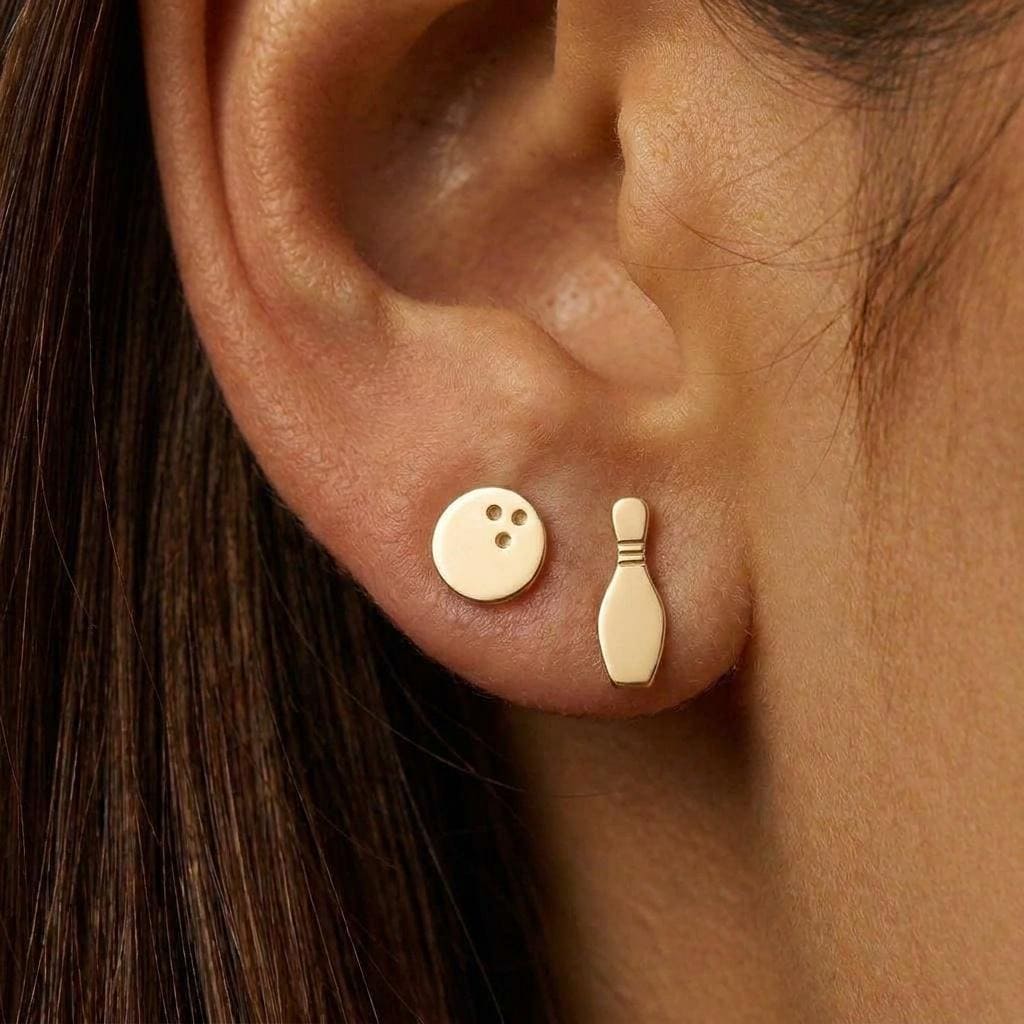 Mismatched gold stud earrings, one bowling pin and one bowling ball. (2 of 8)