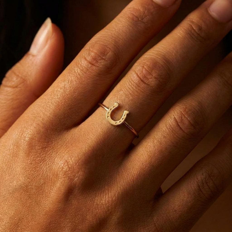 Dainty gold horseshoe ring with a thin band and a small sculpted horseshoe across the top (5 of 8)