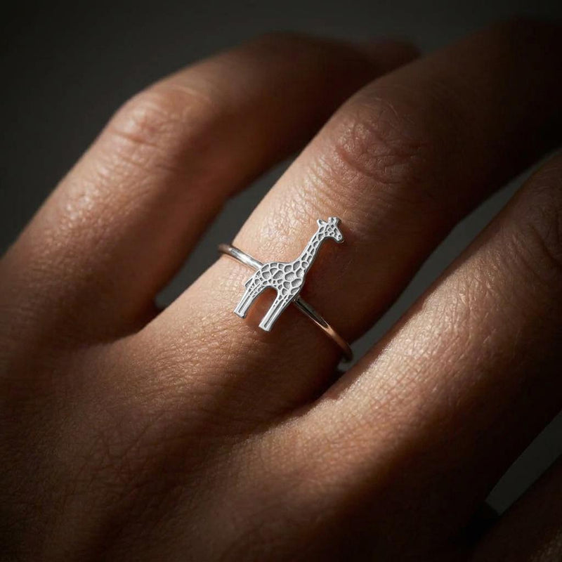 Thin gold ring with a small sculpted giraffe across the top, spots cut into the body (3 of 7)