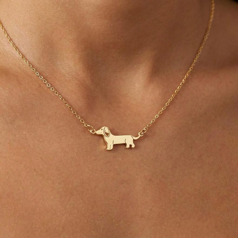 Small gold dachshund charm on a fine cable chain necklace