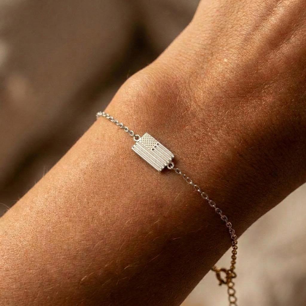 Tiny gold American flag charm with cut stripes and a star field on a fine chain bracelet (2 of 6)