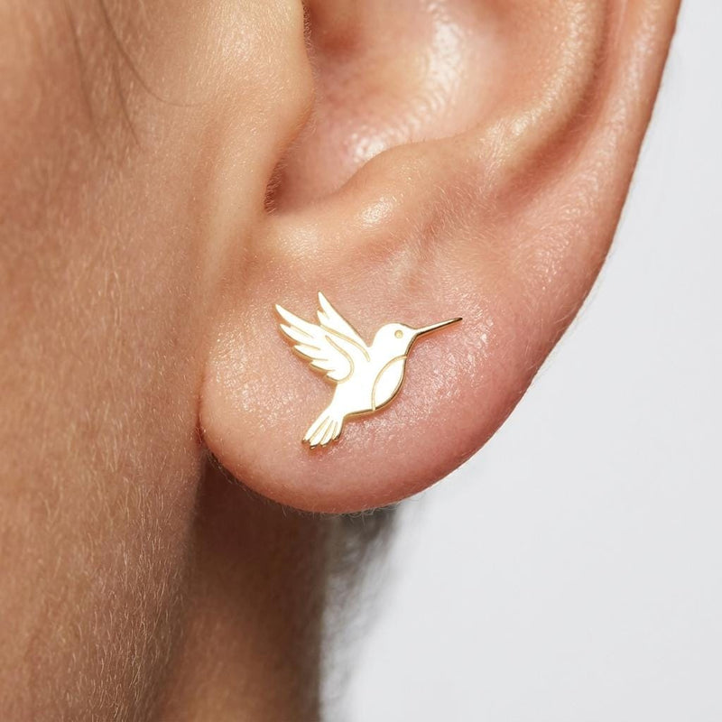 Pair of tiny gold hummingbird stud earrings shown mid-hover with wings back (2 of 5)