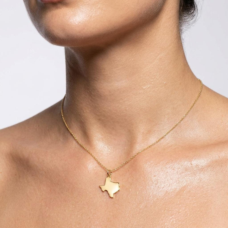 Dainty gold state outline pendant on a fine cable chain, shown flat on white (4 of 8)