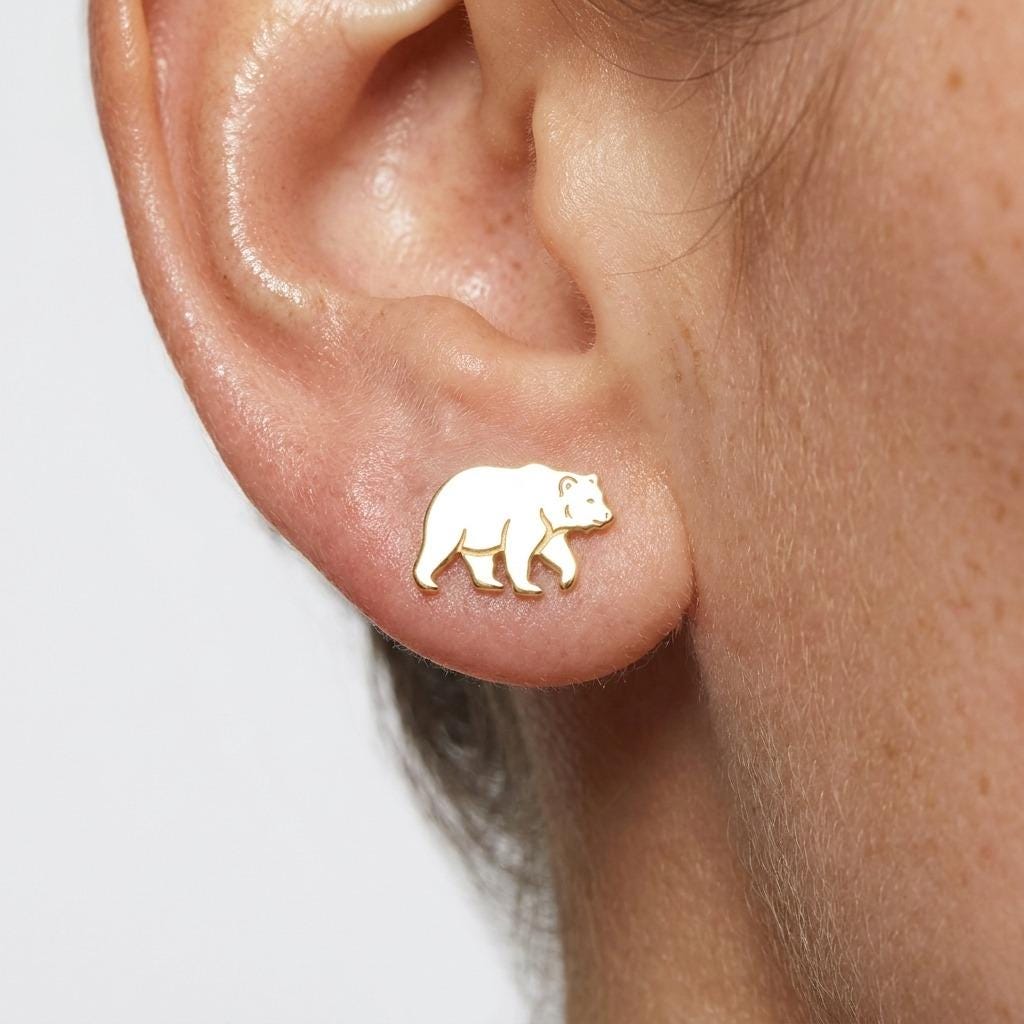 Pair of stud earrings shaped like a walking grizzly bear, in gold (2 of 5)