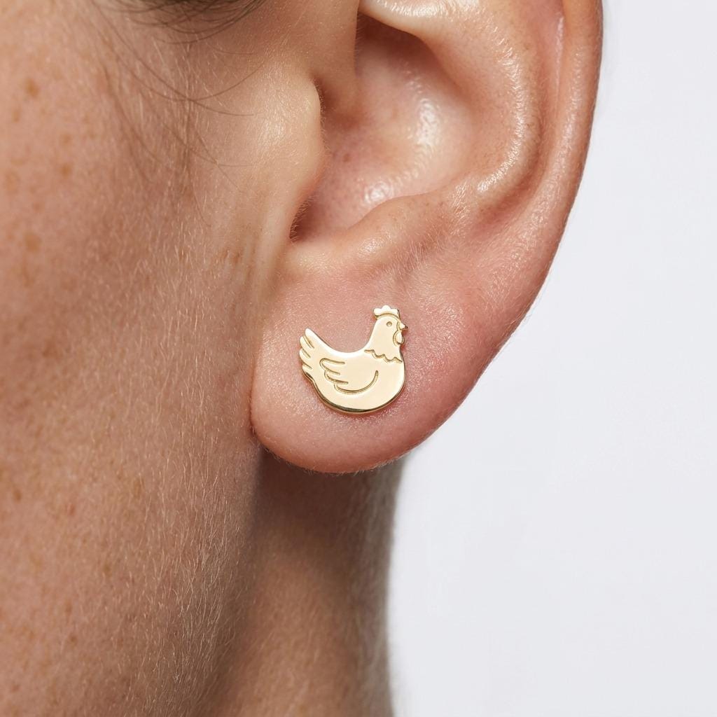 Pair of small gold chicken stud earrings showing a hen in profile (2 of 5)