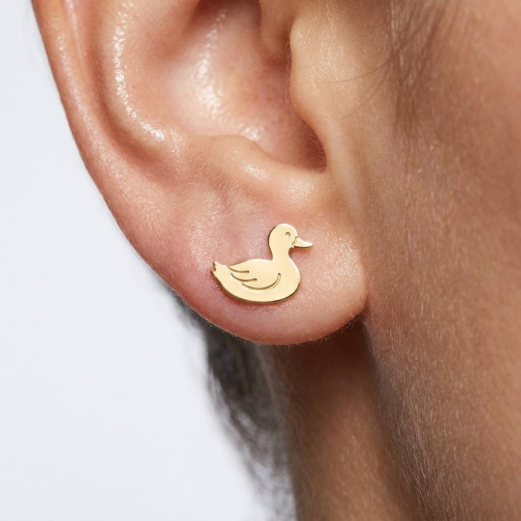 Pair of small duck stud earrings in gold shown in profile (2 of 5)