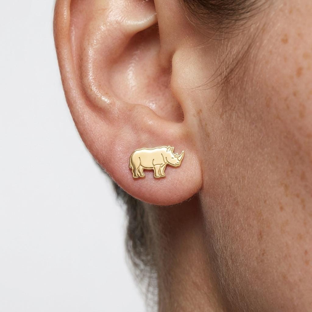 Pair of small gold rhino stud earrings with two horns and heavy shoulders (2 of 5)