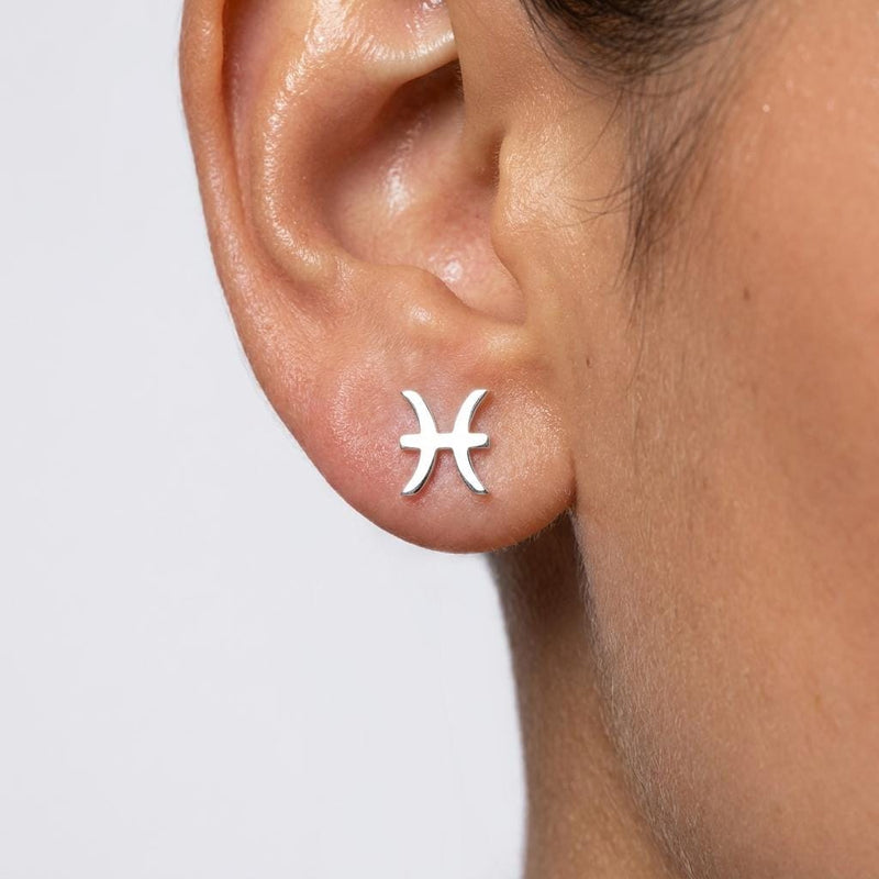 Pair of tiny zodiac sign glyph stud earrings in gold (10 of 14)