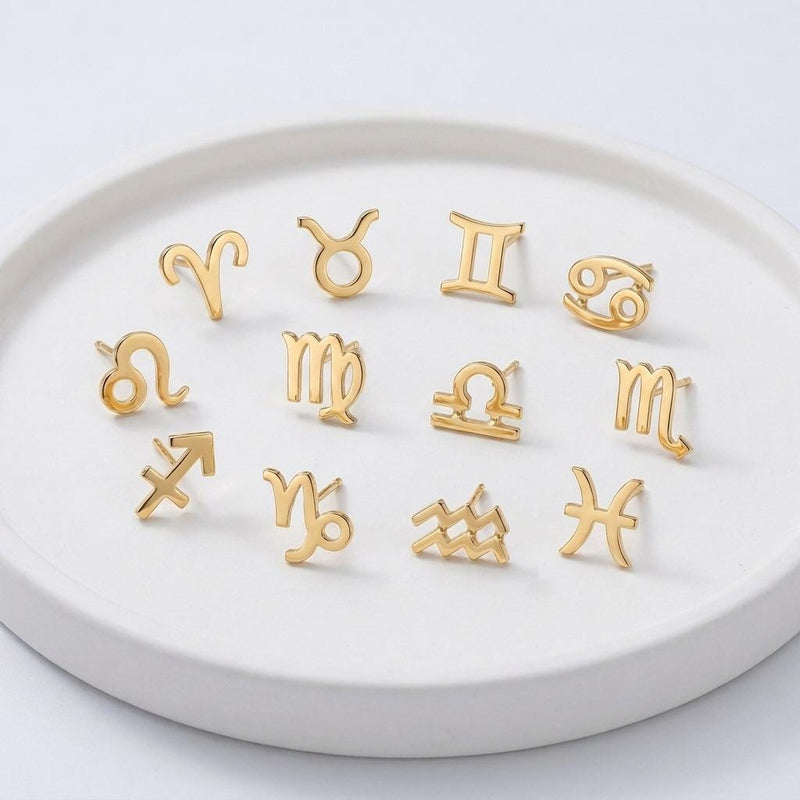 Pair of tiny zodiac sign glyph stud earrings in gold (3 of 14)