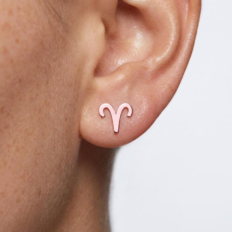 Pair of tiny zodiac sign glyph stud earrings in gold (5 of 14)