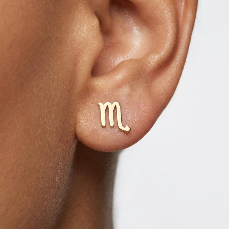 Pair of tiny zodiac sign glyph stud earrings in gold (8 of 14)