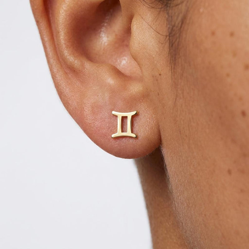 Pair of tiny zodiac sign glyph stud earrings in gold (9 of 14)