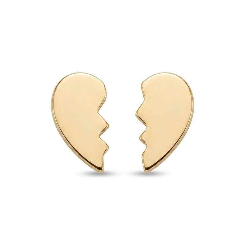 Pair of tiny gold broken heart stud earrings, each a half heart with a jagged edge