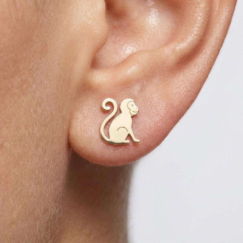 Pair of small gold monkey stud earrings with simple carved facial detail (2 of 6)