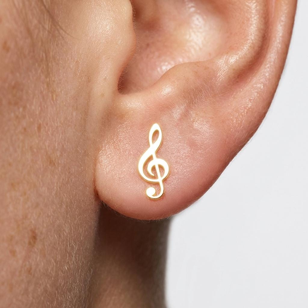 Pair of small gold treble clef stud earrings (2 of 6)