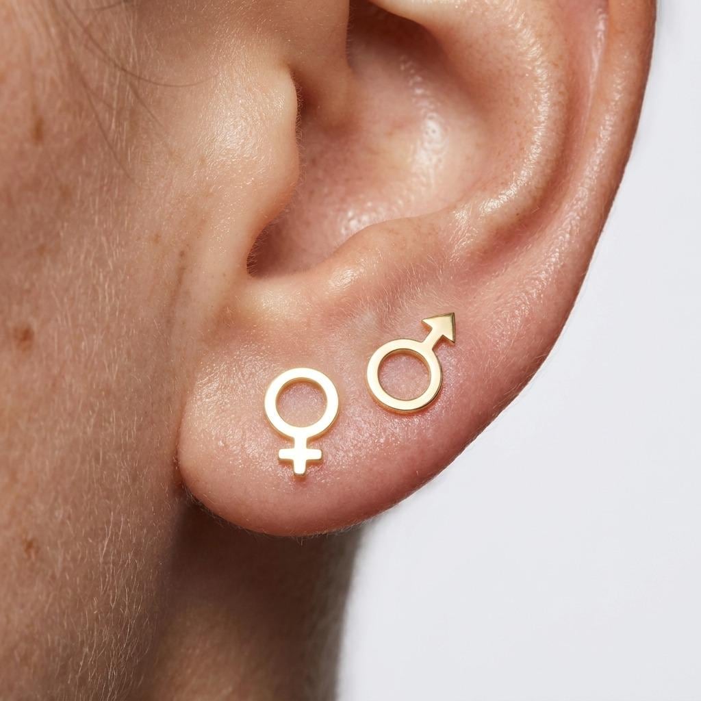 Mismatched pair of gold Venus and Mars symbol stud earrings (2 of 6)