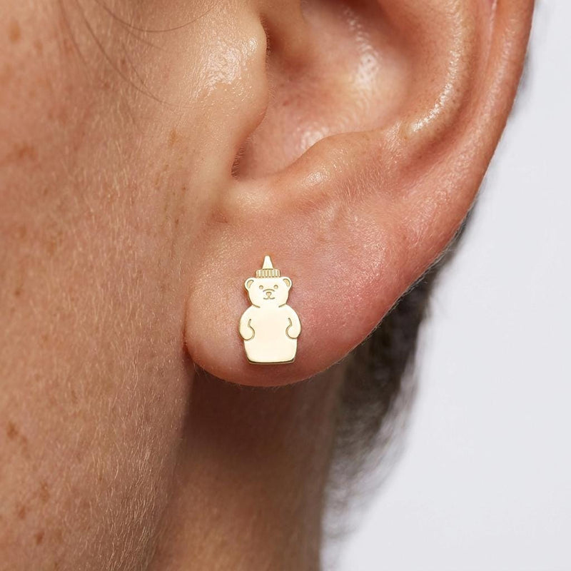 Pair of tiny gold honey bear stud earrings, bear holding a honey pot, on a plain background (2 of 6)