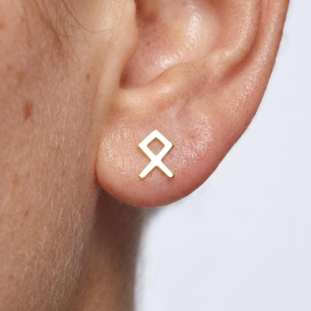 Pair of tiny flat gold Viking rune stud earrings with straight carved strokes