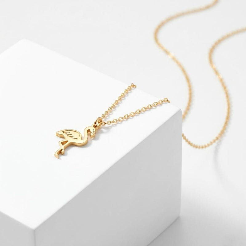 Tiny gold flamingo pendant with curved neck on a fine chain (2 of 5)